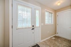 Front Hall with Closet and Garage Access - 