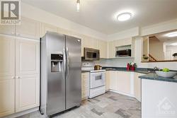 This kitchen offers a convenient pantry and lots of counterspace to prep meals. - 