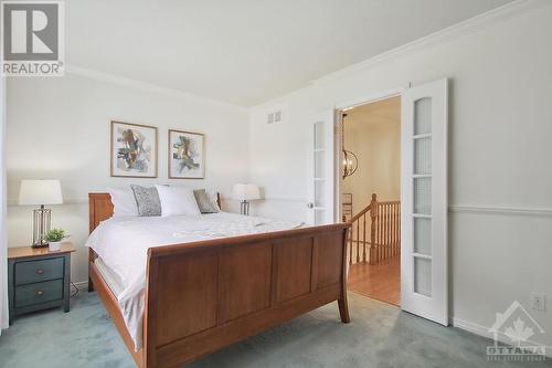 Unique French doors for the bedroom. - 4405 Ashcroft Circle, Ottawa, ON - Indoor Photo Showing Bedroom