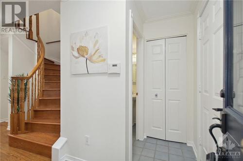 The front hall way gives you access to the powder room and the inside entry to the garage. - 4405 Ashcroft Circle, Ottawa, ON - Indoor Photo Showing Other Room