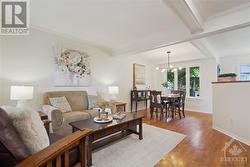 Your guests will appreciate the beautiful hardwood found in this open dining/living area. - 
