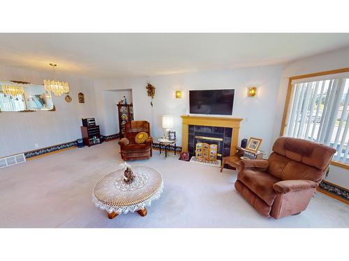 1616 Mt Pyramid Crescent, Cranbrook, BC - Indoor Photo Showing Living Room With Fireplace