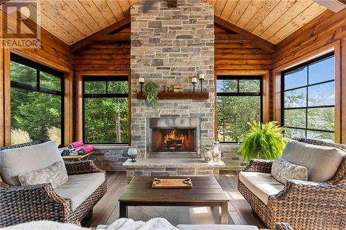 597 Point Trail, Westmeath, ON - Indoor Photo Showing Living Room With Fireplace