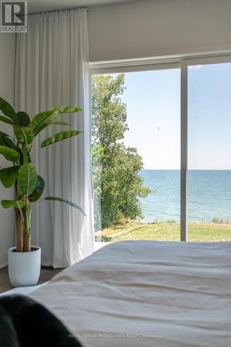 16 Twelve Trees Court, Prince Edward County (Wellington), ON - Indoor Photo Showing Bedroom With Body Of Water