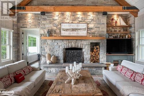 68 Island 120, Port Severn, ON - Indoor Photo Showing Living Room With Fireplace