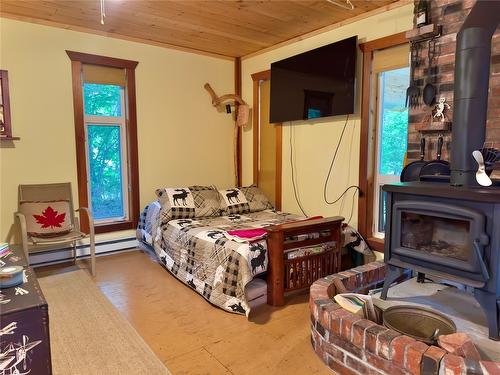 3525 Enderby Mabel Lake Road, Enderby, BC - Indoor Photo Showing Bedroom With Fireplace