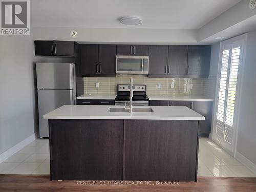 720 - 60 Dunsheath Way, Markham, ON - Indoor Photo Showing Kitchen With Stainless Steel Kitchen With Upgraded Kitchen