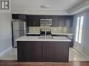 720 - 60 Dunsheath Way, Markham, ON  - Indoor Photo Showing Kitchen With Stainless Steel Kitchen With Upgraded Kitchen 