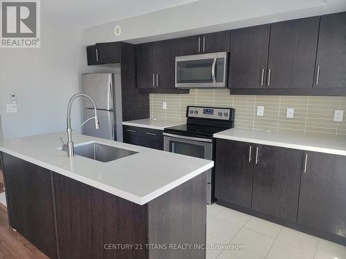 720 - 60 Dunsheath Way, Markham, ON - Indoor Photo Showing Kitchen With Stainless Steel Kitchen With Upgraded Kitchen