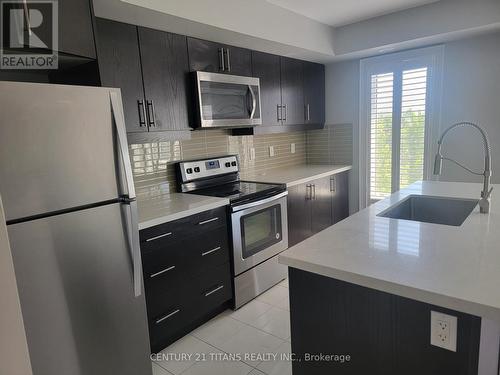 720 - 60 Dunsheath Way, Markham, ON - Indoor Photo Showing Kitchen With Stainless Steel Kitchen With Upgraded Kitchen