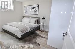 Virtual Staged Photo Lower Level Bedroom - 
