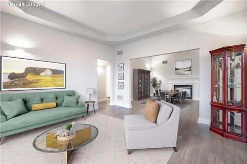 Virtually Staged Photo - 586 Canboro Road, Fenwick, ON - Indoor Photo Showing Living Room With Fireplace