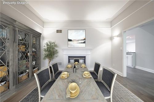 Virtually Staged Photo - 586 Canboro Road, Fenwick, ON - Indoor Photo Showing Dining Room With Fireplace