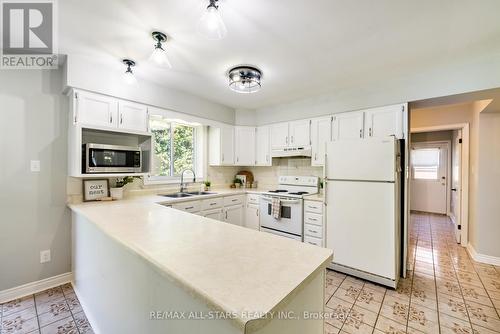 15 Don Court, Kawartha Lakes, ON - Indoor Photo Showing Kitchen With Double Sink