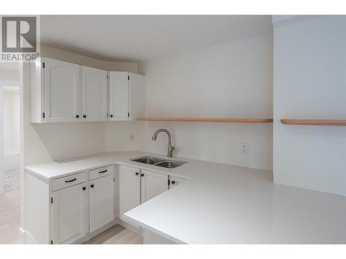 217 Elm Avenue Unit# 207, Penticton, BC - Indoor Photo Showing Kitchen With Double Sink