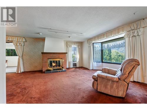 3598 South Main Street, Penticton, BC - Indoor Photo Showing Living Room With Fireplace