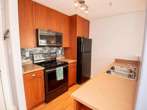 321-2829 Peatt Rd, Langford, BC - Indoor Photo Showing Kitchen With Double Sink