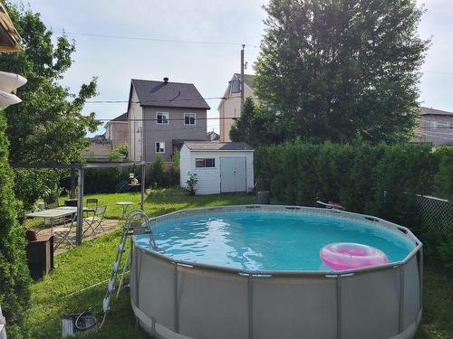 Piscine - 970 Rue De L'Harmonie, Laval (Saint-François), QC - Outdoor With Above Ground Pool With Backyard