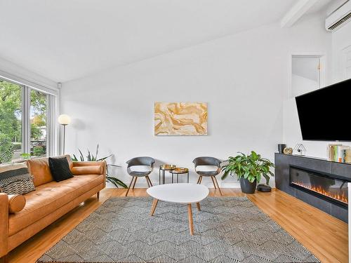 Living room - 7731 Av. Du Mail, Montréal (Anjou), QC - Indoor Photo Showing Living Room With Fireplace