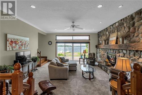 15947 Sunset Drive, Long Sault, ON - Indoor Photo Showing Living Room With Fireplace