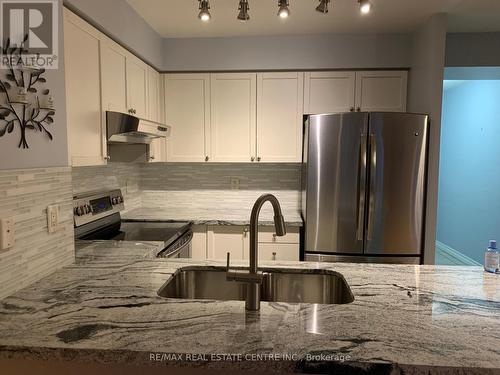 821 - 25 Kingsbridge Garden Circle, Mississauga, ON - Indoor Photo Showing Kitchen With Stainless Steel Kitchen With Double Sink With Upgraded Kitchen