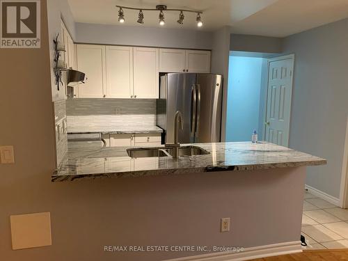 821 - 25 Kingsbridge Garden Circle, Mississauga, ON - Indoor Photo Showing Kitchen With Double Sink