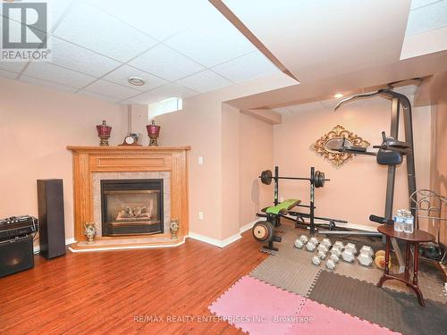 7 Colleyville Street, Brampton, ON - Indoor Photo Showing Gym Room With Fireplace