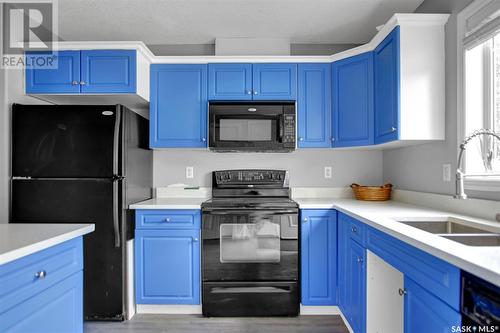 52 2751 Windsor Park Road, Regina, SK - Indoor Photo Showing Kitchen With Double Sink