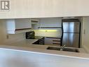 701 - 250 Webb Drive, Mississauga, ON  - Indoor Photo Showing Kitchen With Double Sink 