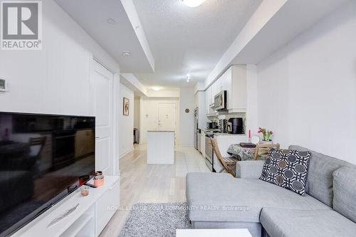 202 - 9201 Yonge Street, Richmond Hill, ON - Indoor Photo Showing Living Room With Fireplace