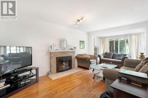 126 St Bees Court, London, ON - Indoor Photo Showing Living Room With Fireplace