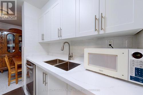 304 - 25 Silver Springs Boulevard, Toronto, ON - Indoor Photo Showing Kitchen With Double Sink