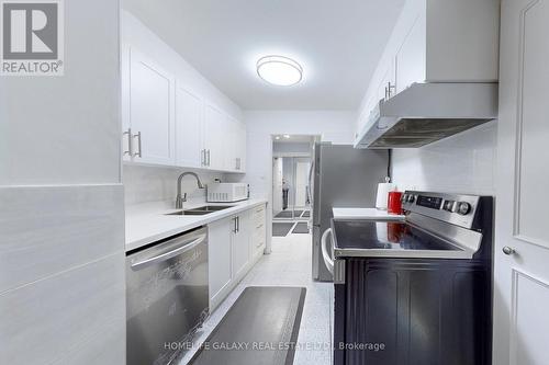 304 - 25 Silver Springs Boulevard, Toronto, ON - Indoor Photo Showing Kitchen With Double Sink