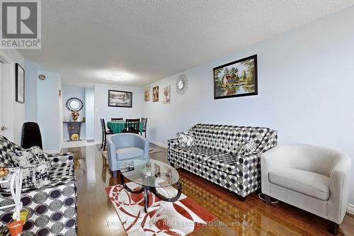 304 - 25 Silver Springs Boulevard, Toronto, ON - Indoor Photo Showing Living Room