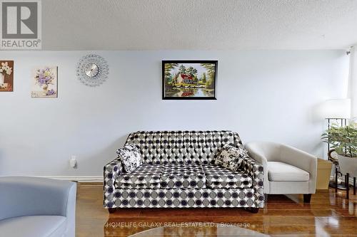 304 - 25 Silver Springs Boulevard, Toronto, ON - Indoor Photo Showing Living Room