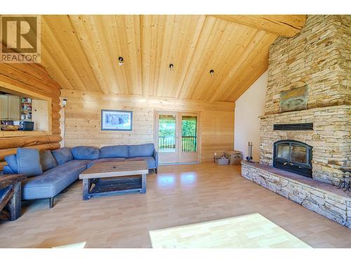 7383 Johnstone Road, Bridge Lake, BC - Indoor Photo Showing Living Room With Fireplace