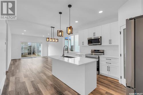 303 Sharma Crescent, Saskatoon, SK - Indoor Photo Showing Kitchen With Upgraded Kitchen
