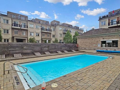 101-17 Coneflower Cres, Toronto, ON - Outdoor With In Ground Pool