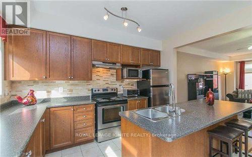 18 Curran Hall Crescent, Toronto, ON - Indoor Photo Showing Kitchen With Double Sink