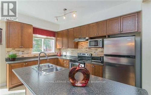 18 Curran Hall Crescent, Toronto E09, ON - Indoor Photo Showing Kitchen With Double Sink