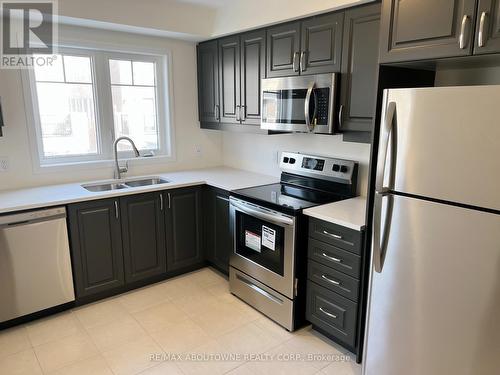 100 - 1000 Asleton Boulevard, Milton, ON - Indoor Photo Showing Kitchen With Stainless Steel Kitchen With Double Sink