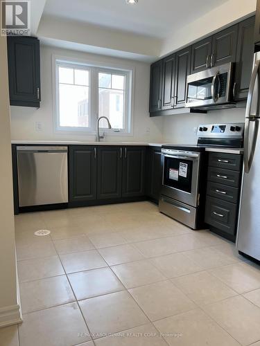 100 - 1000 Asleton Boulevard, Milton, ON - Indoor Photo Showing Kitchen With Stainless Steel Kitchen