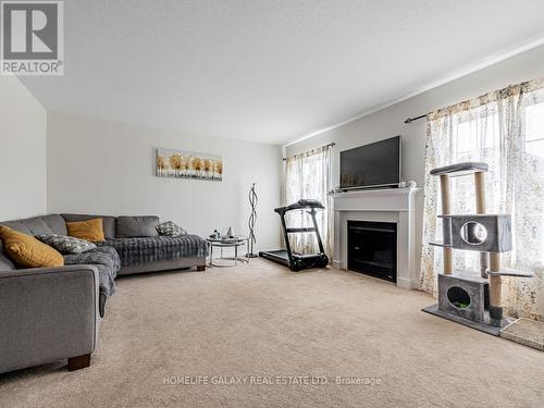 7731 Butternut Boulevard, Niagara Falls, ON - Indoor Photo Showing Living Room With Fireplace