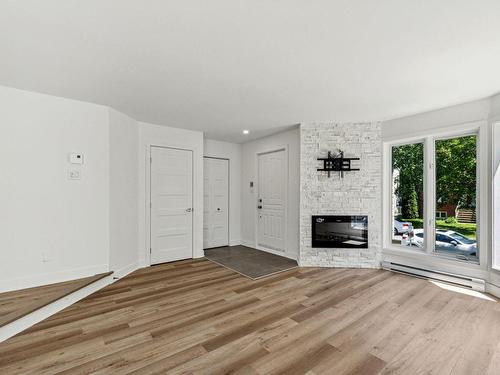 Salon - 68 Rue Félix-Antoine-Savard, Blainville, QC - Indoor Photo Showing Other Room With Fireplace