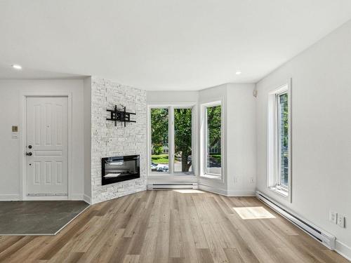 Living room - 68 Rue Félix-Antoine-Savard, Blainville, QC - Indoor With Fireplace