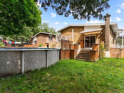 Backyard - 262 Rue Greenfield, Longueuil (Greenfield Park), QC - Outdoor With Above Ground Pool