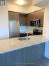 320 - 1603 Eglinton Avenue W, Toronto, ON  - Indoor Photo Showing Kitchen With Double Sink 