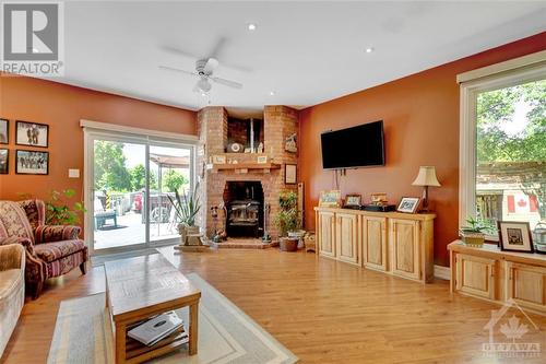 Family Room with Deck Access - 371 Mount St-Patrick Road, Renfrew, ON - Indoor Photo Showing Living Room With Fireplace