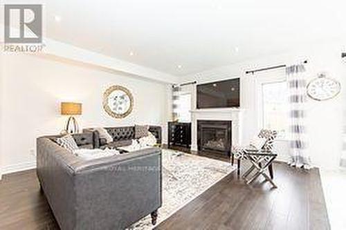 42 St Augustine Drive, Whitby (Brooklin), ON - Indoor Photo Showing Living Room With Fireplace