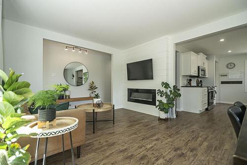 1002 2Nd Street, Brandon, MB - Indoor Photo Showing Living Room With Fireplace